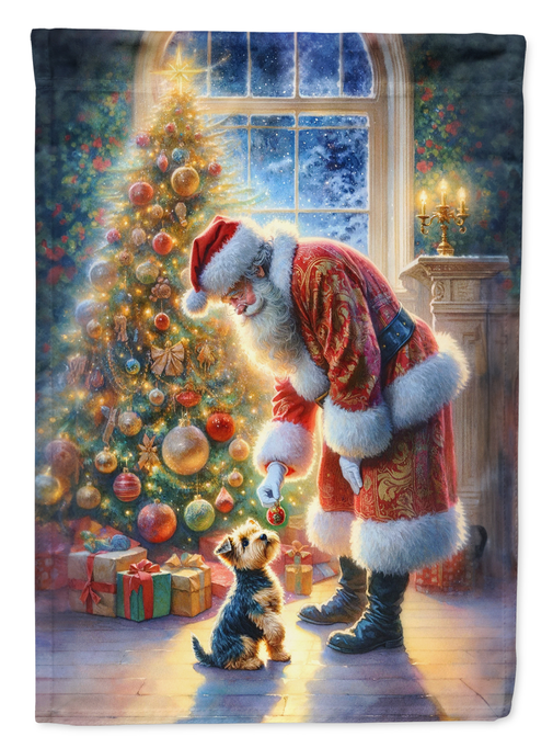 Christmas garden flag showing Santa-costumed dog with gifts and lit tree