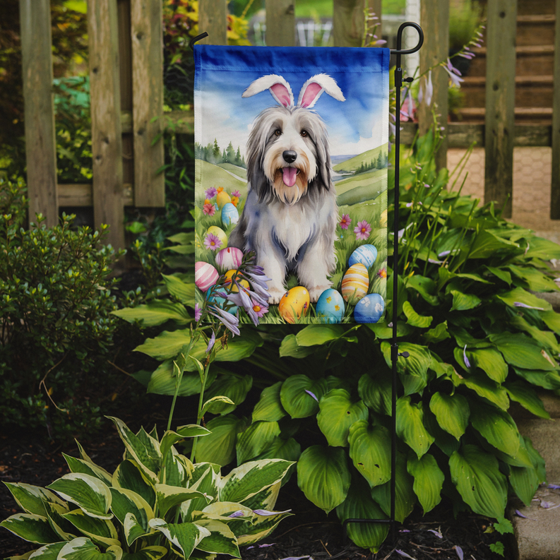 Bearded collie Easter garden flag with dog and colorful eggs in a garden