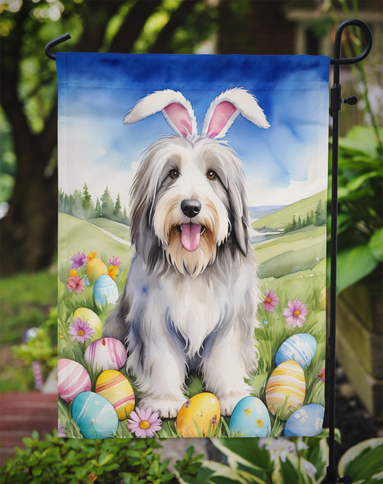 Bearded collie Easter garden flag displayed on a yard stake with eggs and flowers