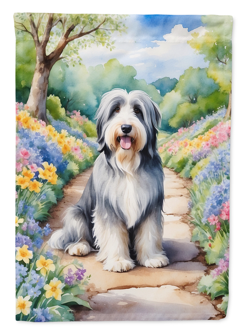 Bearded collie dog portrait garden flag with colorful spring flowers and path