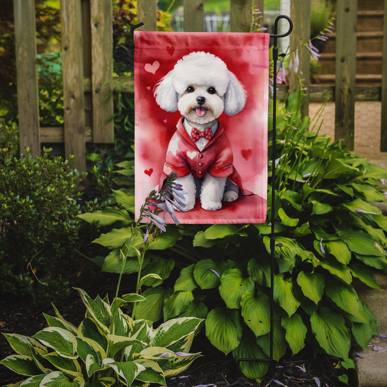 Garden flag featuring a white bichon frise in a red Valentine outfit with small hearts