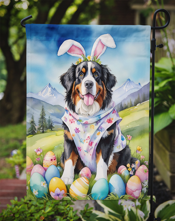 Easter garden flag with a Bernese mountain dog sitting among painted eggs on a garden stake