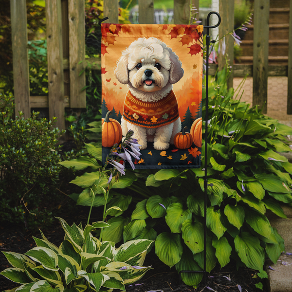 Autumn garden flag with white bichon frise in orange sweater, pumpkins and leaves