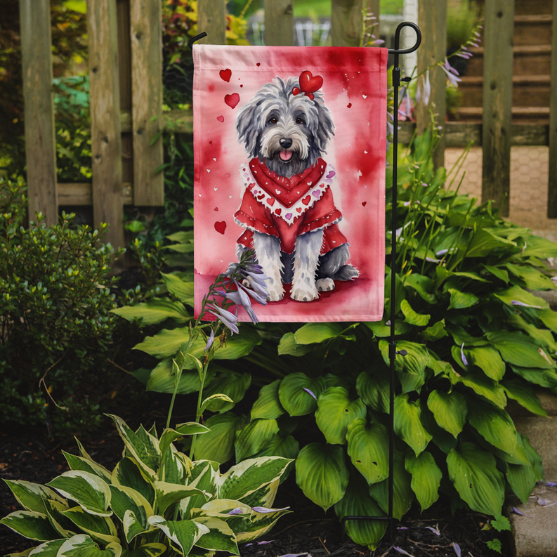Valentine garden flag on stake showing gray-and-white sheepdog in red with hearts