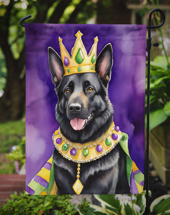Garden flag close-up of black German shepherd with Mardi Gras crown and beads