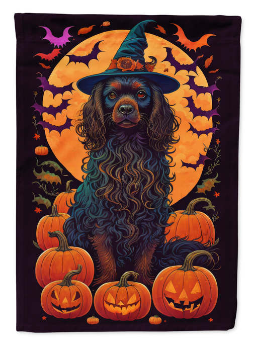 Halloween garden flag with blue-black spaniel in witch hat surrounded by pumpkins