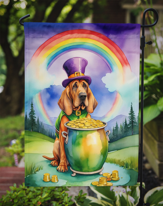 Garden flag close view: cartoon bloodhound in purple leprechaun hat with gold coins under rainbow