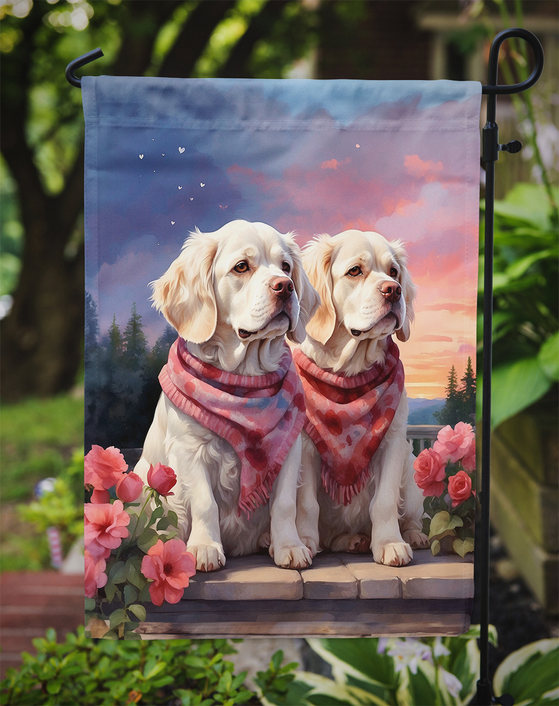 Clumber spaniel heart garden flag on a stake with two dogs in red and pink bandanas