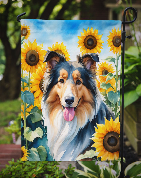 Garden flag close-up: collie dogs with yellow sunflowers in a garden scene