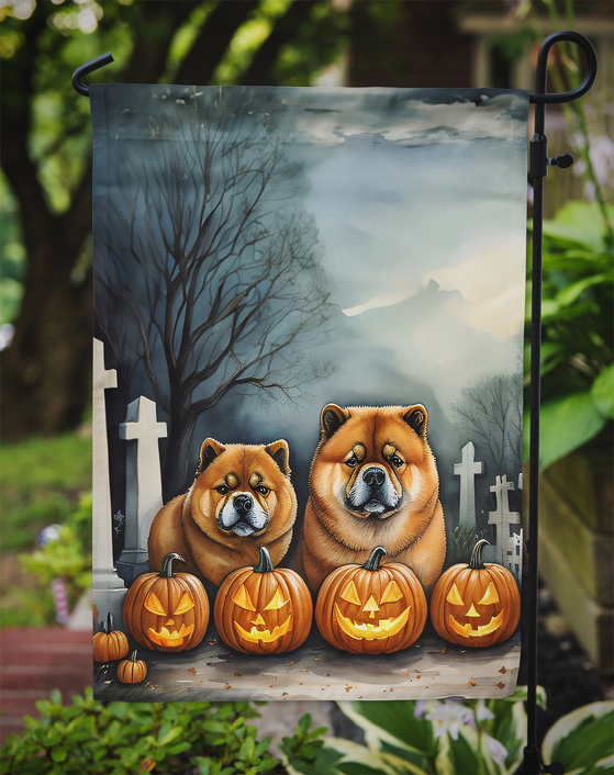 Halloween garden flag hanging outside, showing two Chow Chows and carved pumpkins