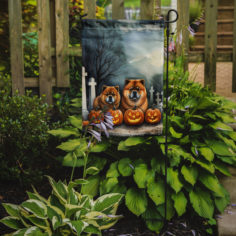 Halloween garden flag on a stand, featuring two Chow Chows, pumpkins, and tombstones