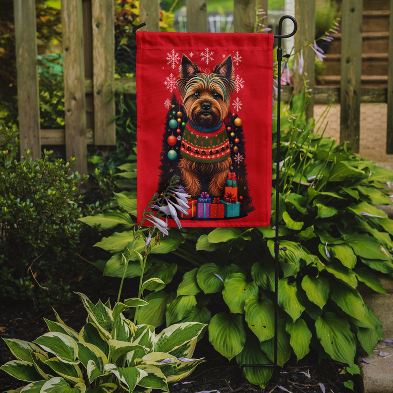 Red holiday garden flag with Cairn terrier, snowflakes, and wrapped gifts, on metal stand