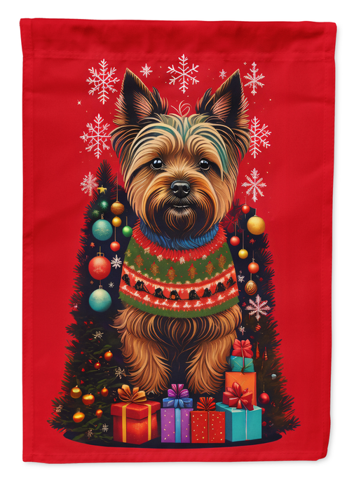 Red holiday garden flag close-up: Cairn terrier in winter scarf with snowflakes and gifts