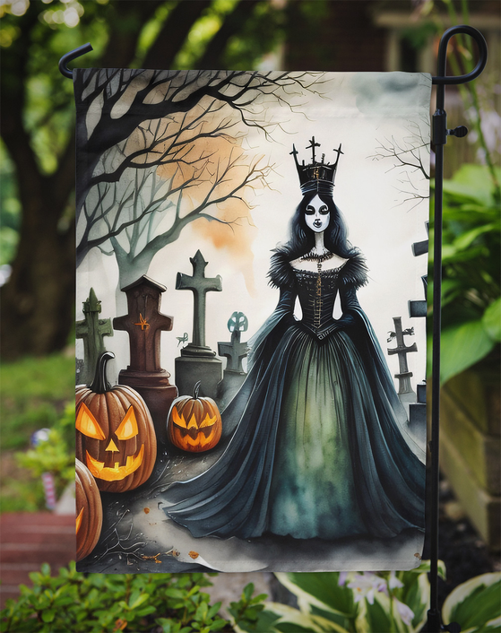 Spooky Halloween garden flag close-up with evil queen, pumpkins, and graveyard crosses.