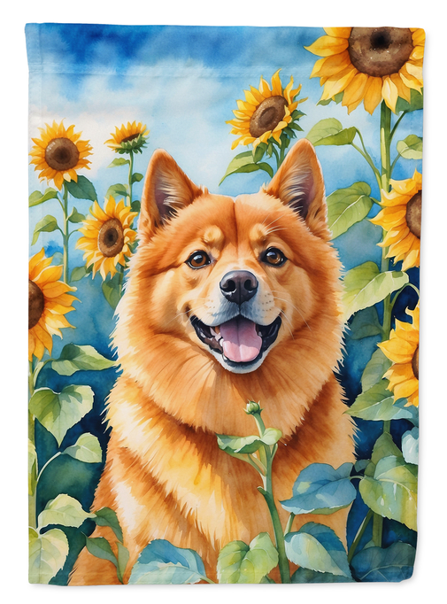 Garden flag with an orange Finnish Spitz portrait surrounded by yellow sunflowers and green foliage.