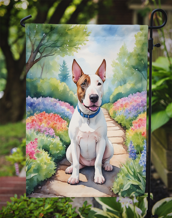 Garden flag showing a bull terrier on a spring path with colorful blooms