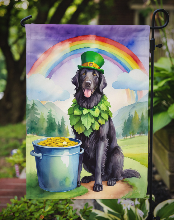 Garden flag on outdoor hook with black retriever wearing green hat, rainbow and gold pot