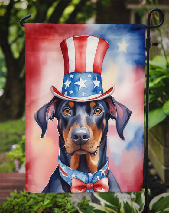 Patriotic Doberman garden flag with Uncle Sam hat and bow tie hanging on yard stake