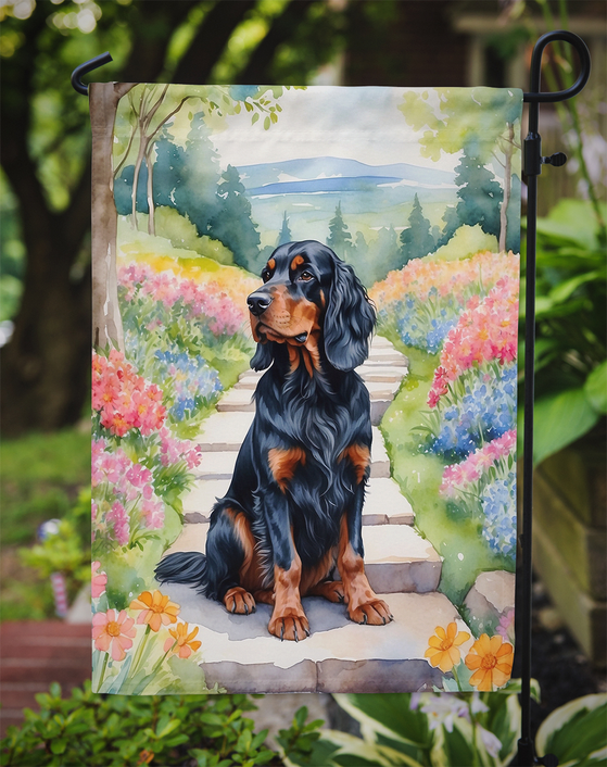 Garden flag with Gordon setter on spring path, hanging on metal stake