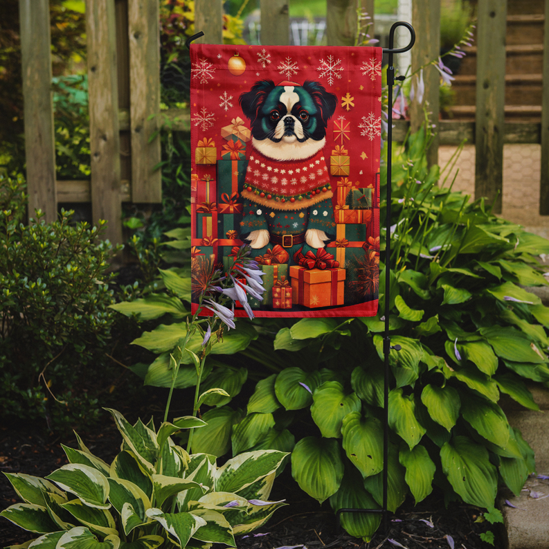 Red Japanese Chin holiday garden flag with presents, ornaments, and snowflakes