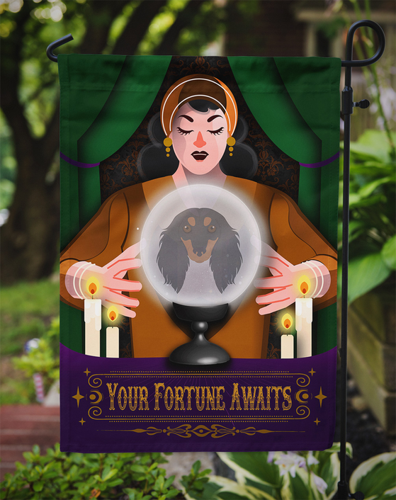 Halloween garden flag close view on stand: fortune teller face and glowing crystal ball with dachshund