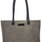 Earthtone tote bag with black handles and rectangular front patch label