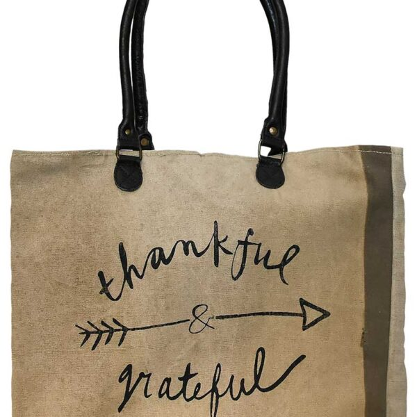 Earthtone market tote with 'thankful & grateful' lettering and arrow