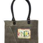 Recycled military tent shoulder bag with illustrated front patch and black handle straps