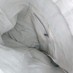 Recycled military tent crossbody bag interior lining, folded fabric and stitching