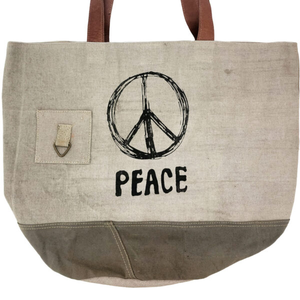 Earthtone peace sign tote bag with canvas handles and front peace graphic