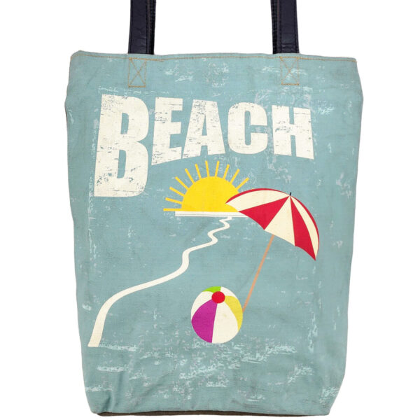 Teal canvas tote bag with “BEACH” graphic and black top handles