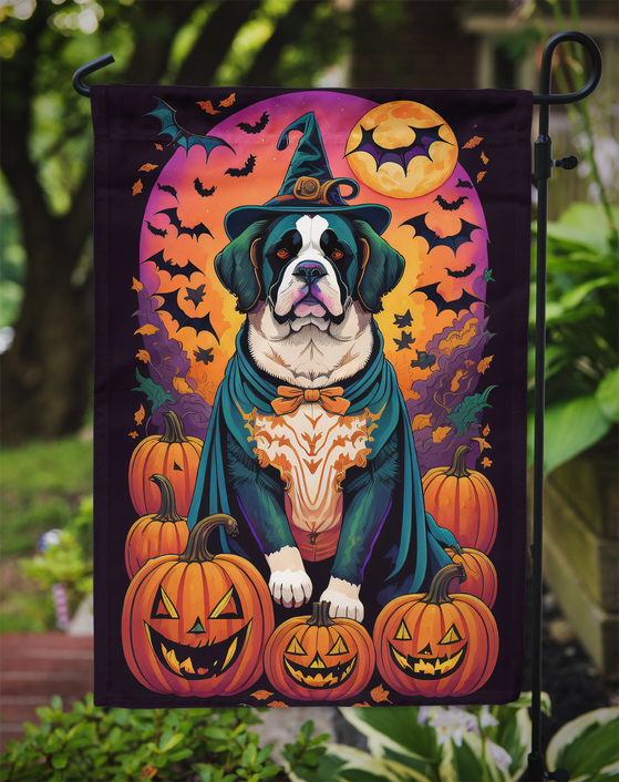 Halloween garden flag on metal stake, featuring Saint Bernard witch with bat and pumpkin graphics