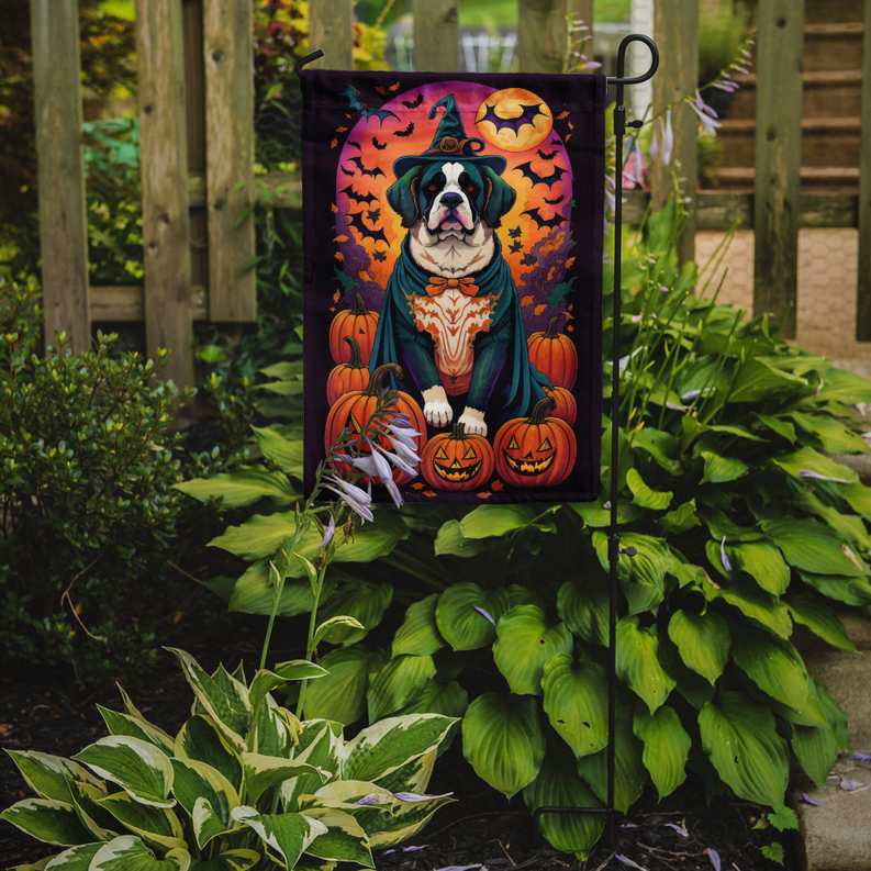 Halloween garden flag displayed in yard on stakes with Saint Bernard witch pumpkin design