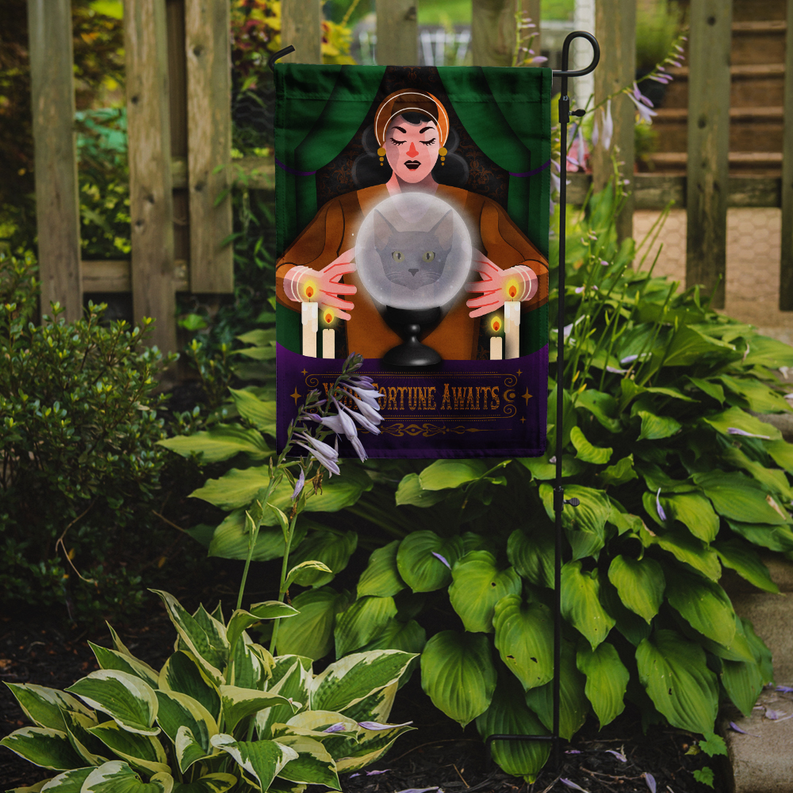 Halloween garden flag with fortune teller holding glowing crystal ball and gray cat