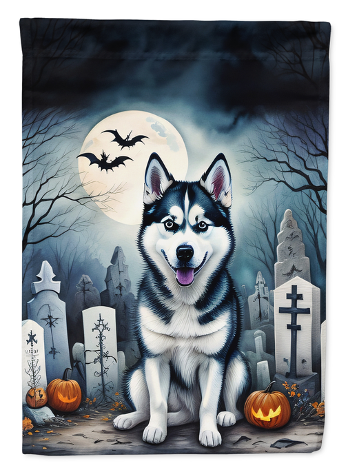 Halloween garden flag featuring a black-and-white husky standing in graveyard