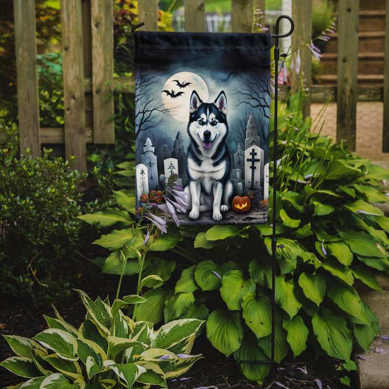 Halloween garden flag with husky and bats displayed on outdoor stand