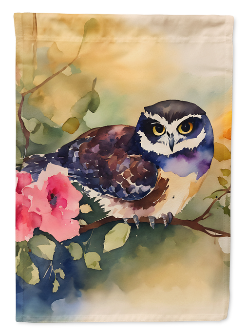 Spectacled owl garden flag with watercolor owl, pink flower, and green leaves on cloth