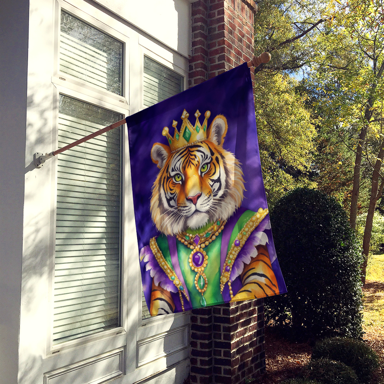 Tiger Mardi Gras house flag hanging on brick wall with crowned tiger design