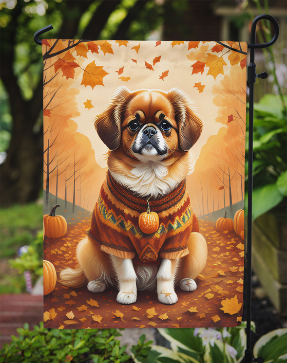 Fall garden flag with Tibetan spaniel dog in orange sweater among autumn leaves