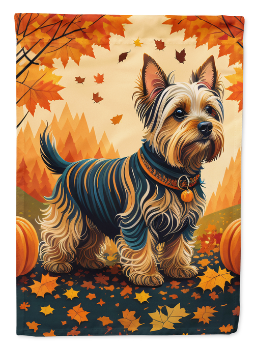 Autumn garden flag close-up: Yorkshire terrier with orange leaf background