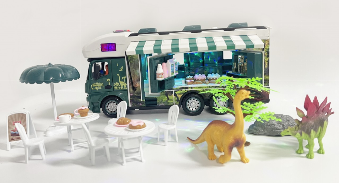 Jurassic toy RV with glowing interior, outdoor table set, and dinosaur figures