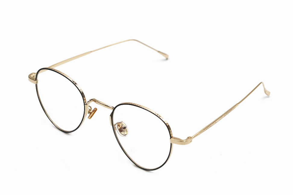 Round metal sunglasses with gold-tone frames and rhinestone-trimmed bridge
