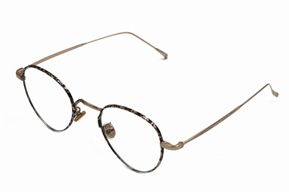 Round metal sunglasses with tan frames and rhinestone-trimmed temples