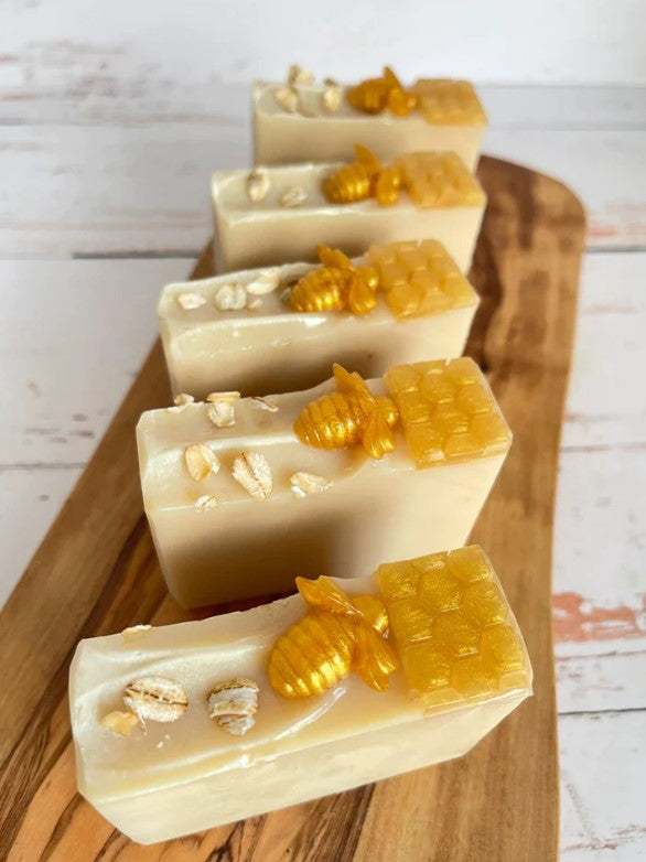 Ivory-gold honeycomb and bee embossed soap bars, stacked display