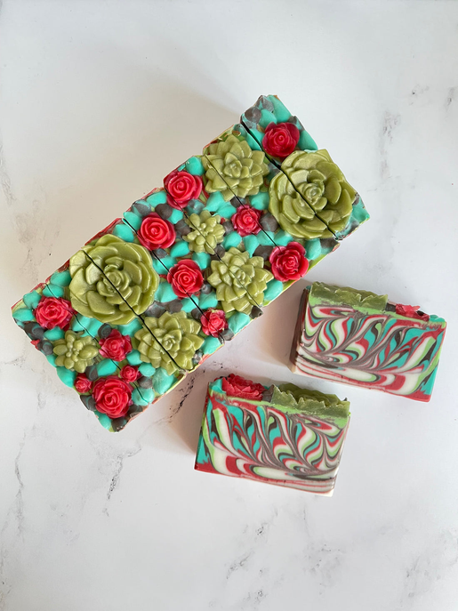 Decorative rose garden soap bars with teal, green, red and white swirl layers