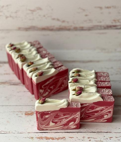 Ole de Rose soap bars with pink and white marbled swirls and rosebud accents