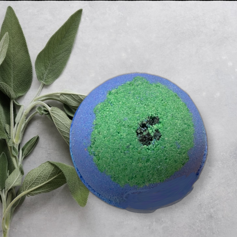 Blue bath bomb with green center speckled patch