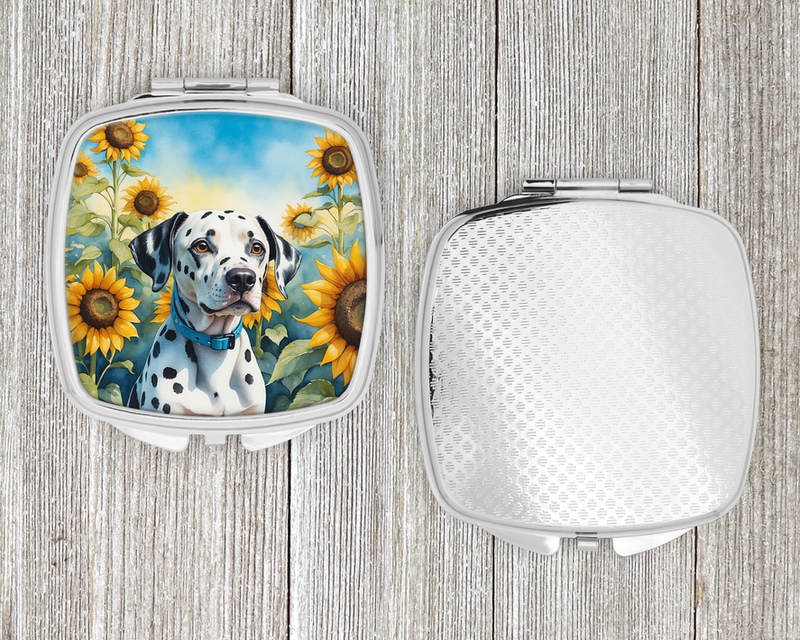 Silver compact mirror open, showing textured back and sunflower dalmatian lid