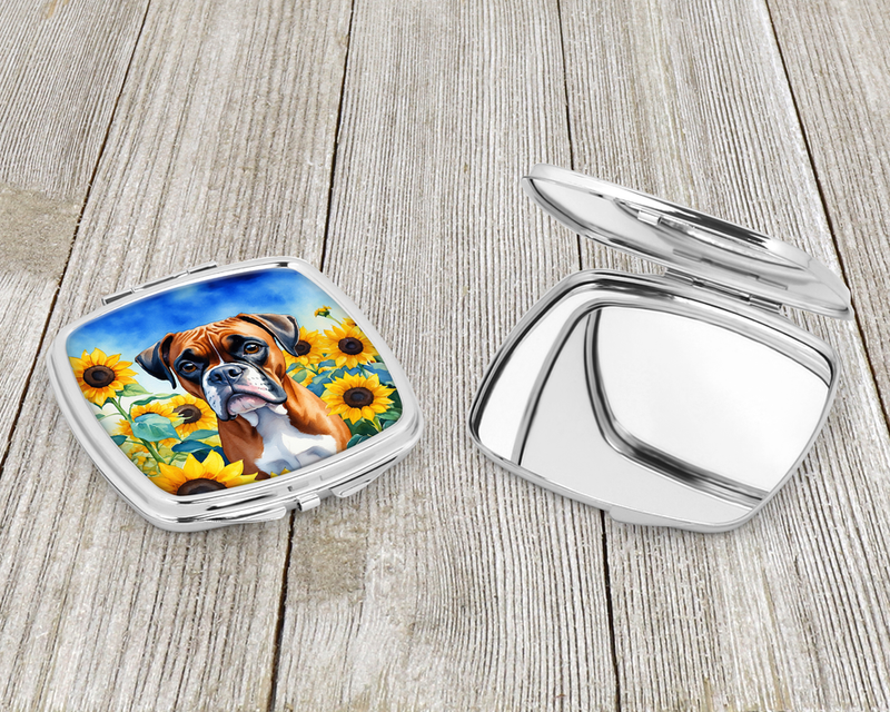 Open compact mirror with silver lid and front showing brown boxer sunflower artwork.