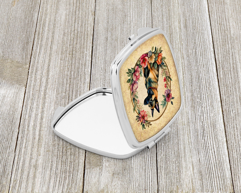 Silver compact mirror open view with Belgian Malinois in floral garden frame